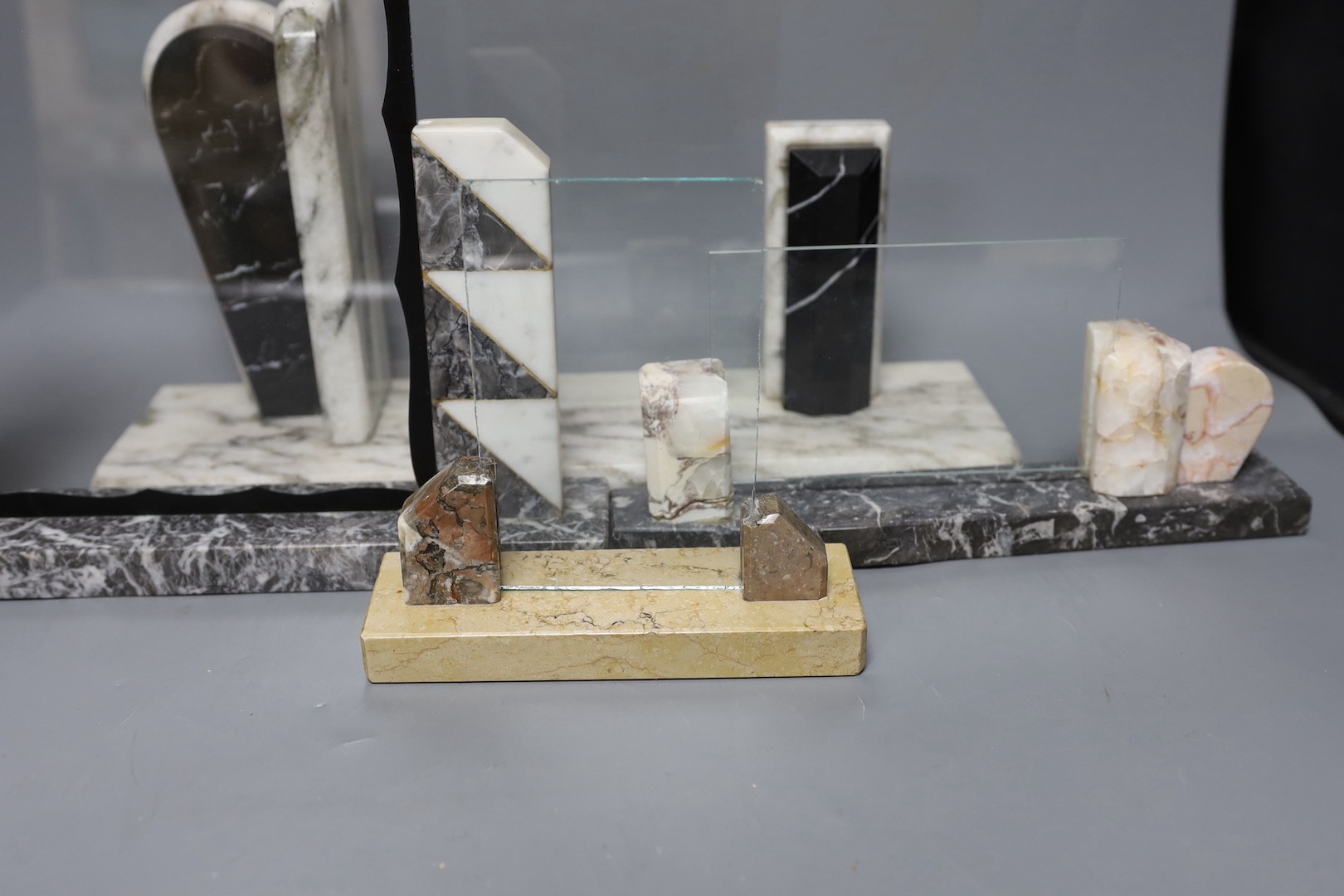 Four various Deco style marble picture frames, largest width 38cm, height 27cm